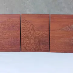 A direct view of the three-panel minimalist mountain art. This piece is perfect for adding a touch of understated nature to a modern or rustic interior.