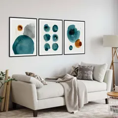 Add a splash of color with this abstract set of three watercolor prints. The interplay of teal and orange shapes creates a vibrant, modern look, perfect for brightening up a minimalist living room.