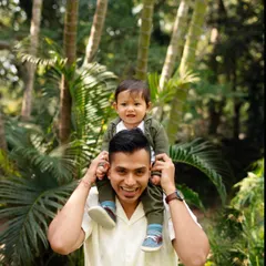 The view from dad's shoulders is the best. I love capturing these playful and loving interactions between a father and his child.