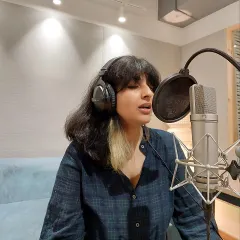 Sukhnidh laying down some vocals in our booth. Our space is designed to be a comfortable and creative environment for artists to bring their ideas to life.