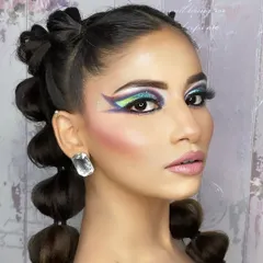 Makeup is my art. This look shows my creative side, combining a bold, multi-color graphic eyeliner with a flawless skin finish. It's perfect for editorial shoots or for anyone who wants to make a vibrant statement.