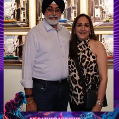A couple enjoying the bar night. Our photo booth offers a fun activity for guests to enjoy between drinks and dancing.