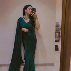 A selfie in a stunning emerald green satin saree. I love playing with different colors and fabrics.