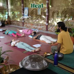 The goal is to heal. In this residential sound healing course, participants lie in Savasana while I guide them through a sound journey. The handpan in the foreground is one of over 45 instruments used to facilitate deep healing.