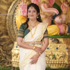 Another shot of Sneha's Varapooje look, showing how the makeup complements the traditional attire and setting.