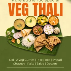 A complete and authentic pure veg thali served on a banana leaf, offering a delightful mix of flavors, textures, and nutrition in one meal.