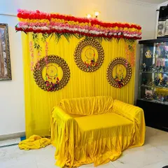 A slightly different angle of the yellow mehndi backdrop. The setup is compact and can fit easily in a living room to create a dedicated space for the ceremony and for taking pictures.