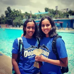 Another one of our dedicated swimmers from the Dolphin swim team celebrating a victory. We focus on creating a supportive environment where every athlete can reach their full potential.