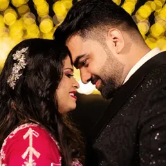 A close-up portrait filled with warmth and affection. The soft glow of the fairy lights creates a romantic atmosphere, perfect for capturing the intimacy of an engagement celebration. It's these emotional portraits that truly tell your love story.