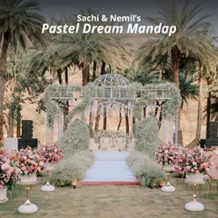 Sachi and Nemil's 'Pastel Dream Mandap' was an ethereal vision set amidst a grove of palm trees. We used a delicate iron framework draped with baby's breath and soft pastel florals to create a romantic, open-air sanctuary.