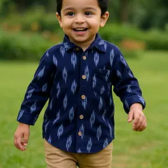 I believe boys' clothes should be just as comfortable and stylish. This handwoven Ikat shirt is a perfect example. It's soft enough for playtime and smart enough for a family function, letting him run and be himself.