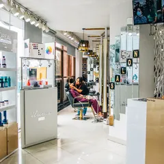 Our salon is equipped with professional products from brands like L'oreal and Schwarzkopf to give you the best results. You can see our product display and reception area as you walk in.