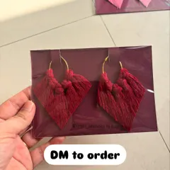 A pair of my diamond-shaped macrame tassel earrings in a beautiful deep red color, all packed up and ready to go.