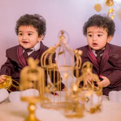 A dreamy and elegant setup for twins. This celestial theme features golden birdcages and a soft, cloud-like floor, creating a magical atmosphere for your twin boys' or girls' photoshoot.
