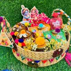 Spread the joy of color this Holi with our handcrafted hamper. This beautiful boat-shaped basket is filled with organic gulal, snacks, and drinks, all decorated with a fun Krishna-Radha theme.