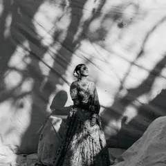 As architects, we are drawn to light and shadow. This black and white bridal portrait uses the stark contrast of shadows to create a fine art piece, highlighting the bride's elegance and the quiet emotion of the moment. It’s where documentary meets magazine style.