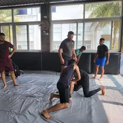 A typical seminar scene at our institute. Students are focused and engaged as a guest instructor breaks down a technique. The environment is built for serious learning and skill acquisition.