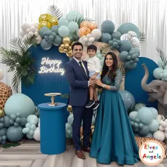 A chic and modern take on a jungle safari theme. This setup uses a sophisticated color palette of blues and greens, with animal print balloons, tropical leaves, and a neon 'Happy Birthday' sign for a stylish celebration.