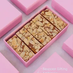 A box of our delicious almond toffee bars, neatly sliced and ready to be shared. This is one of our most requested items for bespoke hampers.