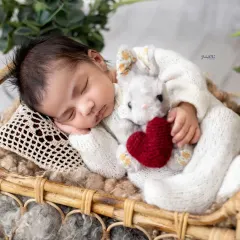 Cuddled up with a tiny bunny friend, this newborn is just precious. I have a collection of soft toys and props that add a touch of sweetness to the photos while keeping your baby secure.