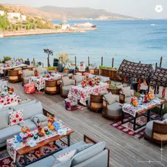 An aerial view of a stunning seaside lounge setup in Turkey. We design spaces that flow with the natural landscape, offering guests comfort, luxury, and breathtaking views.
