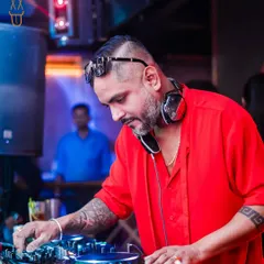 In the zone, crafting the perfect set. Every track is chosen to keep the energy high and the crowd moving. This is a glimpse of me at my console, focused on the mix at The Fixx Bar.