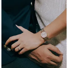 Sometimes, the smallest details tell the biggest story. This close-up of the couple's hands shows the engagement ring, the watch, the texture of their outfits. It’s a quiet, intimate detail from their stylish cocktail night.