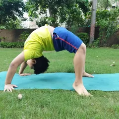 Flexibility training is for everyone. This young champion is working on his back bridge, a gymnastics move we use to develop full-body strength and coordination.