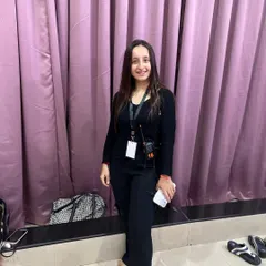 Backstage after the award ceremony, equipped with a walkie talkie. This shows my dual role as both a creative artist and a hands on event coordinator.