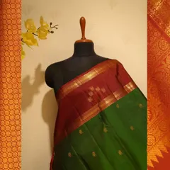 The full view of the maroon and green Kanjivaram, showcasing the beautiful contrast achieved with the Korvai technique.