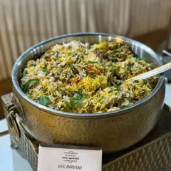 My Veg Biryani is a masterpiece of flavor, slow-cooked with fragrant basmati rice, a medley of fresh vegetables, and aromatic spices. It is a complete meal in itself.