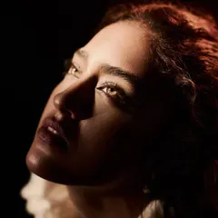 A close-up portrait from the 'Velvet Shadows' series, where I used a single, focused light source to sculpt the model's face. The technique, known as Rembrandt lighting, creates a painterly effect that highlights her expression and the subtle glow of her skin.