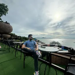 Taking in the scenic coastal views in Thailand. These moments of reflection are important for maintaining focus and perspective in a demanding profession.