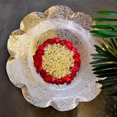 This exquisitely designed nickel-plated thal is a must-have for your home. Its intricate craftsmanship makes it a beautiful centerpiece for floating flowers or candles.