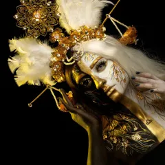 A full view of the Libra-themed fantasy makeup. This avant-garde look uses gold and white body paint, custom headpieces, and delicate details to represent balance and celestial beauty.