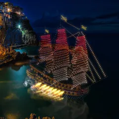 I combine cutting-edge technologies for maximum effect. In this show, I used LED drones to construct the detailed silhouette of a pirate ship while pyrodrones fired simulated cannon shots, creating an immersive and thrilling narrative experience.