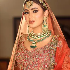 A classic bridal pose. The makeup is designed to look perfect from every angle, ensuring you are picture-perfect throughout your wedding day.