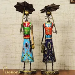 A set of two handcrafted metal figurines depicting ladies in traditional attire holding umbrellas. The vibrant, hand-painted details make these a unique and colorful addition to your home decor, celebrating Indian artistry.