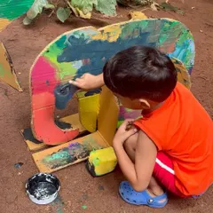 A young artist brings his own patchwork elephant to life. In our themed workshops, children get to create their own versions of characters from the stories we read, making the narrative a personal and tangible experience.