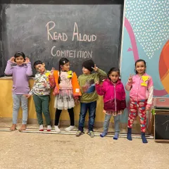 The whole group posing after a successful Read Aloud Competition. Every participant is a winner in our eyes.