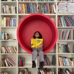 From our "quick-fix design chronicles," a fun and functional reading nook for a library. We designed this circular red pod to create an immersive and playful space for young readers.