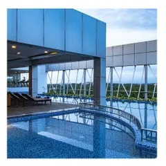 The rooftop swimming pool at a luxury hotel in Calicut, Kerala. The design offers guests a serene escape with expansive views, showcasing our ability to create premium leisure amenities.