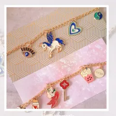 Here are two custom bracelets I made, each telling a different story. One features a magical winged unicorn and protective evil eye, while the other has a dreamy mermaid, a Virgo zodiac sign, and a boba tea charm for the foodie.
