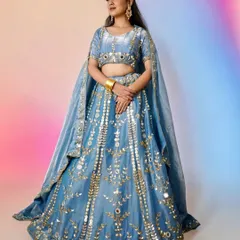 A full-length view of the look taught in my pro course. Students learn how to create makeup that complements grand outfits like this embroidered blue lehenga.