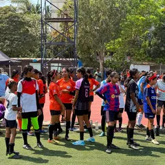 A group of young players listening intently during a break in the trials. The energy and focus were inspiring.