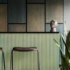 This bespoke outdoor bar is a seamless blend of craftsmanship and design. We paired a fluted mint-green facade with the richness of stained teak wood and matte black accents for a striking and artful look.