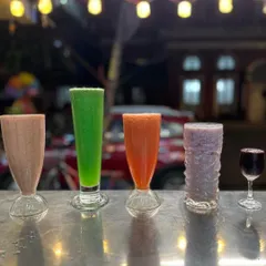 A lineup of our refreshing fresh juices. We offer a variety of fruit juices like grape, watermelon, and muskmelon to quench any thirst.