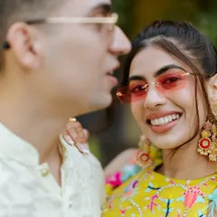 A close-up of this fun pool party look. The pink-tinted sunglasses and bold earrings are the perfect accessories for her colorful outfit and my fresh, sun-kissed makeup.