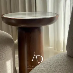 A unique, custom-made side table crafted from rubberwood with a stone top. Its cylindrical base and matte PU finish give it a premium, modern look.