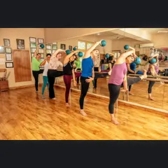 I love the energy of our group sessions! Here, we're using the barre and mini stability balls for a coordinated movement that improves balance, posture, and creates a lovely rhythm in the body.